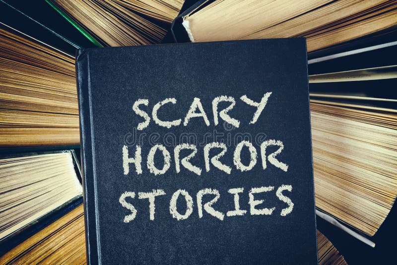 Top view of old hardcover books with Scary Horror Stories book o
