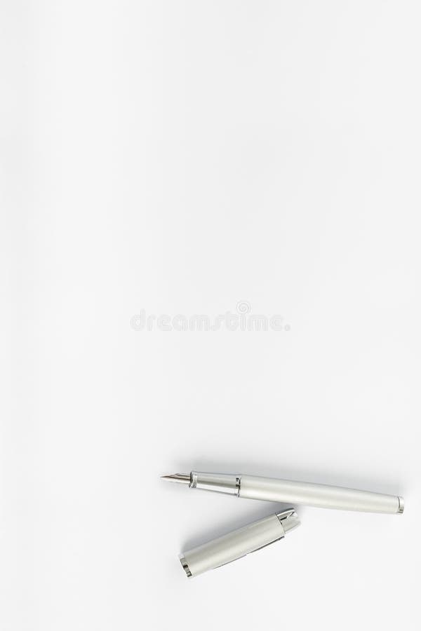 Top view of open ink pen lying on blank sheet of white paper royalty free stock image Top view of open ink pen lying on blank sheet of white paper royalty free stock image