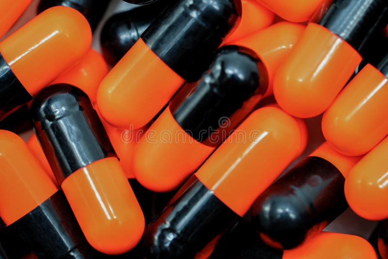 Orangeblack Capsule Pills. Antibiotics Drug Resistance. Drug Use with