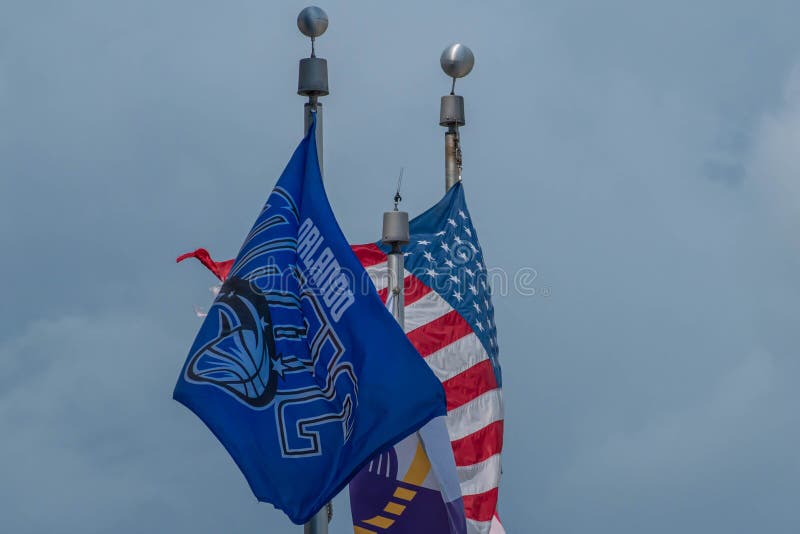 Top view of Orlando Magic, USA and Florida state flags at downtown area 88. Orlando, Florida. August 17, 2019. Top view of Orlando Magic, USA and Florida state stock image Top view of Orlando Magic, USA and Florida state flags at downtown area 88. Orlando, Florida. August 17, 2019. Top view of Orlando Magic, USA and Florida state stock image