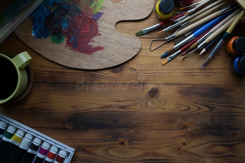 Download premium image of Paintbrushes and art tools in a cup by