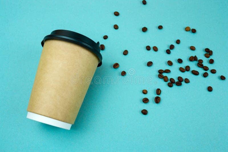 paper coffee to go cup coffee beans on blue background stock image paper coffee to go cup coffee beans on blue background stock image