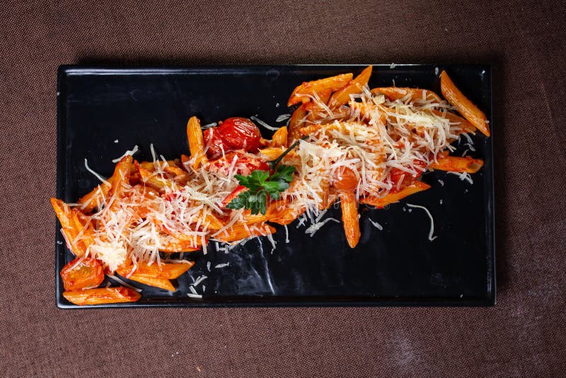 Top View of the Pasta of Hard Varieties in a White Plate Stock Photo