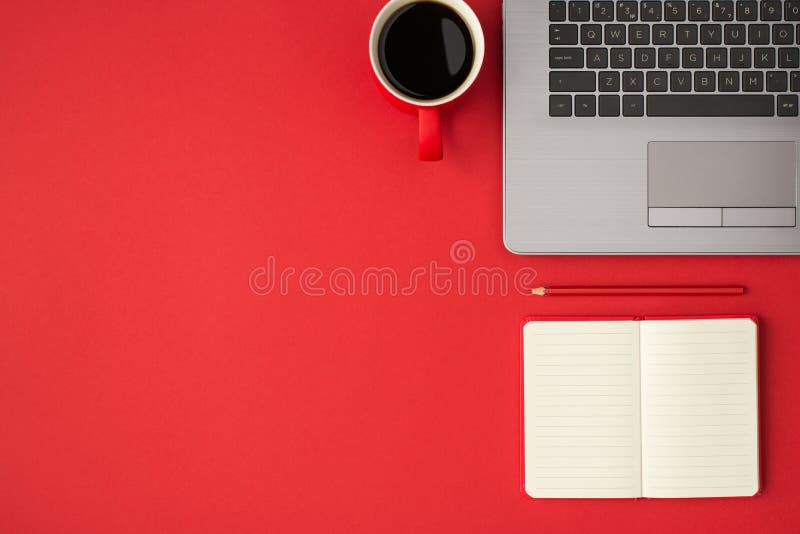 Top view photo of laptop rep planner pencil and cup of coffee on isolated red background with empty space stock photography