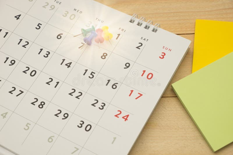 Top View. Pin Putting on Desktop Calendar and Have Postit Note Stock