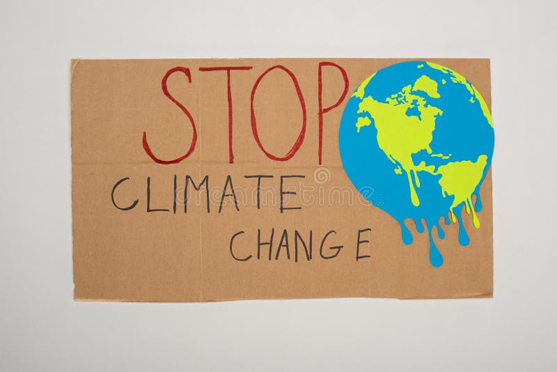 Top view of placard with painted globe and stop climate change lettering on grey background, global warming concept