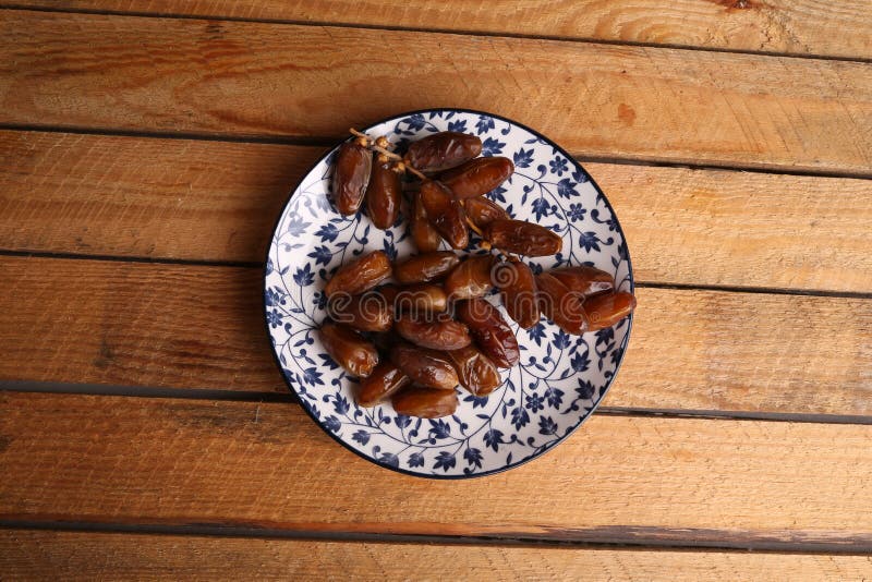 Top View of a Plate of a Fruit Similar To Raisins Called Dates Stock