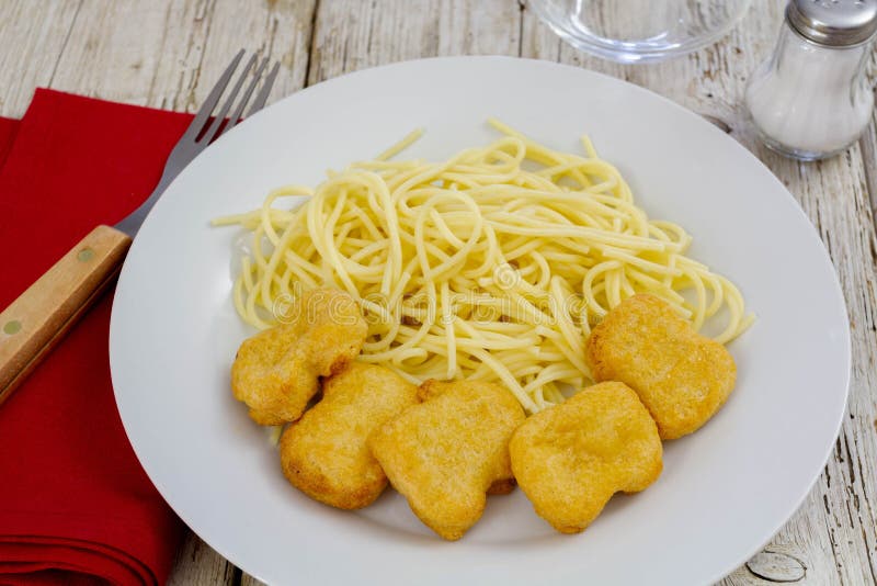 A Plate of Spaghetti with Chicken Nuggets Stock Image - Image of ...