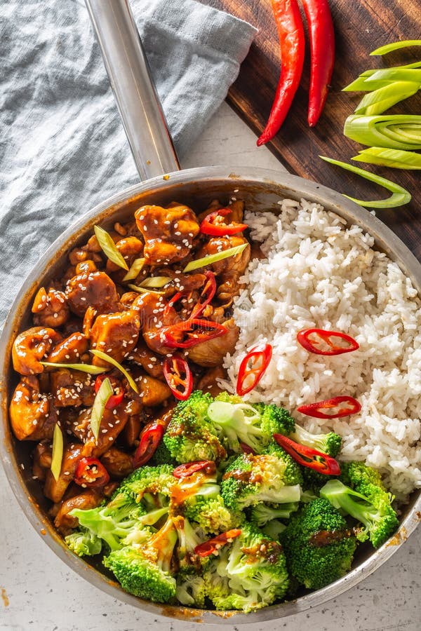 Spicy Teriyaki Chicken with Steamed Broccoli and Rice in a Pot Stock ...