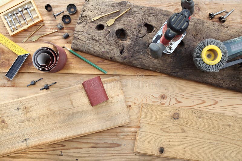 Top View of Power Tools for Woodworking on Wooden Boards Stock Photo