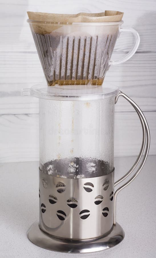 Top View the Process of Brewing Ground Coffee in a Funnel V60 and