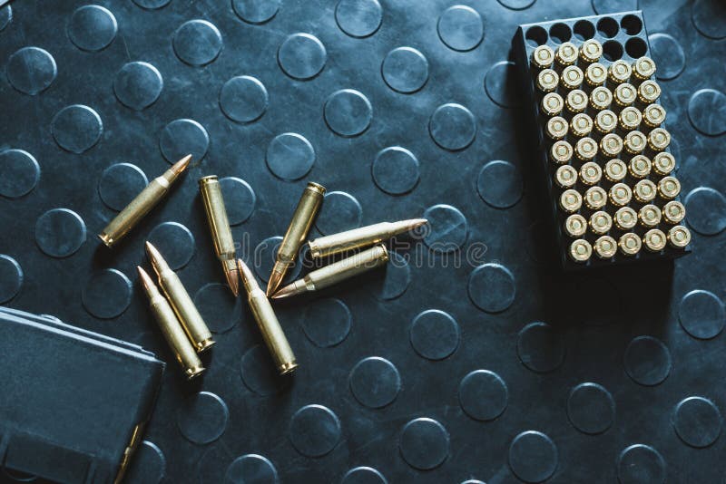 Top view of rifle bullets and magazine on table royalty free stock photos