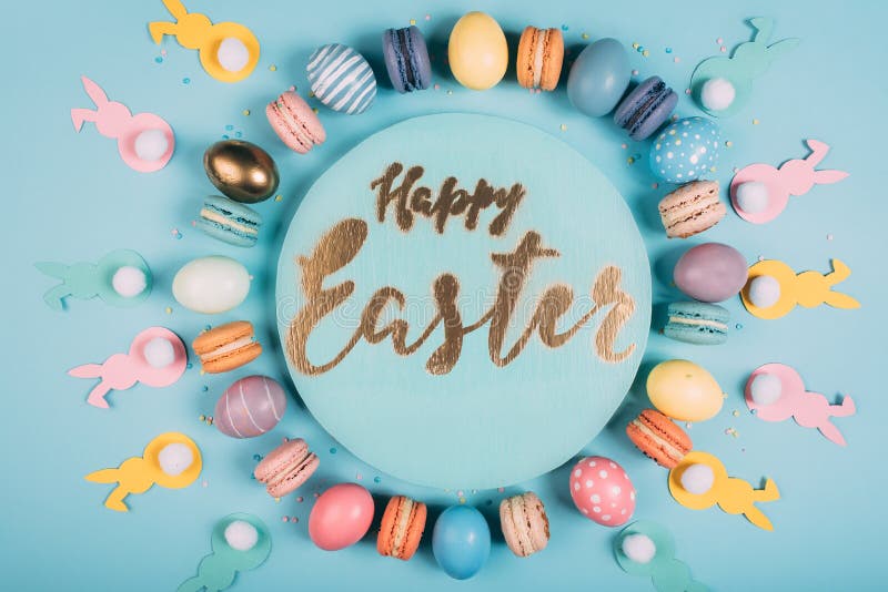 Top view of round board with happy easter lettering and colorful easter decor around royalty free stock image