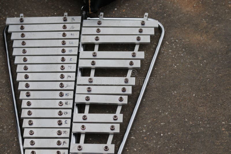 Top View of a Silver Steel Xylophone Instrument Placed on the Floor