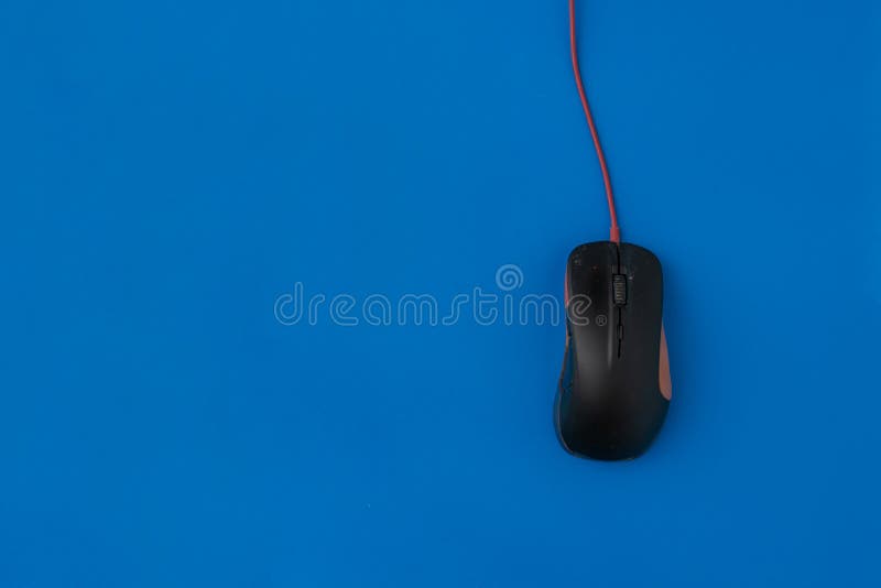 Top view of the simple computer mouse on the color background with copy space, minimalist concepts