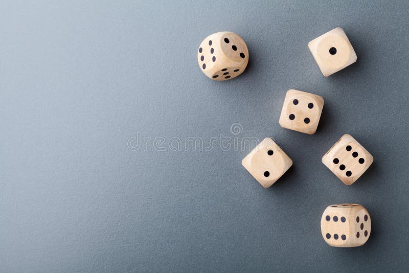 Top view of six wooden dice on table. Board game. Gambling devices.