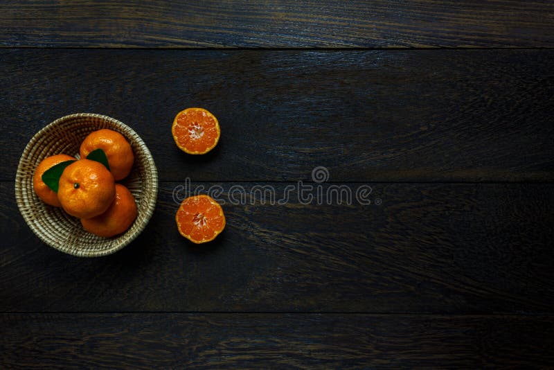 Top view sliced orange on rustic wooden and basket. stock photography