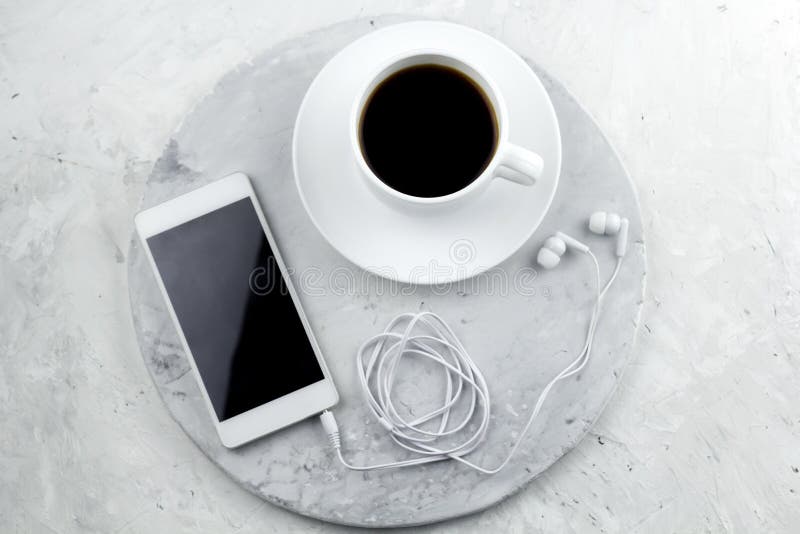 Top view smartphone with empty screen and coffee cup royalty free stock photos