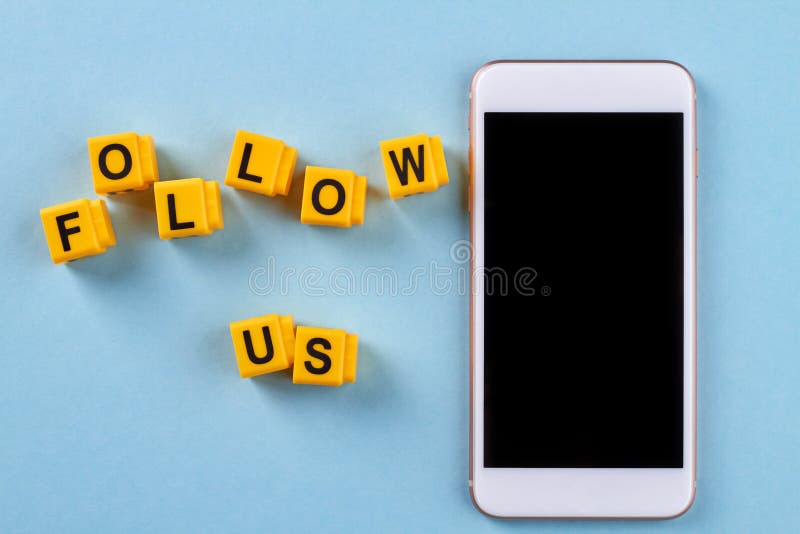 Top view smartphone and follow us words. royalty free stock photos