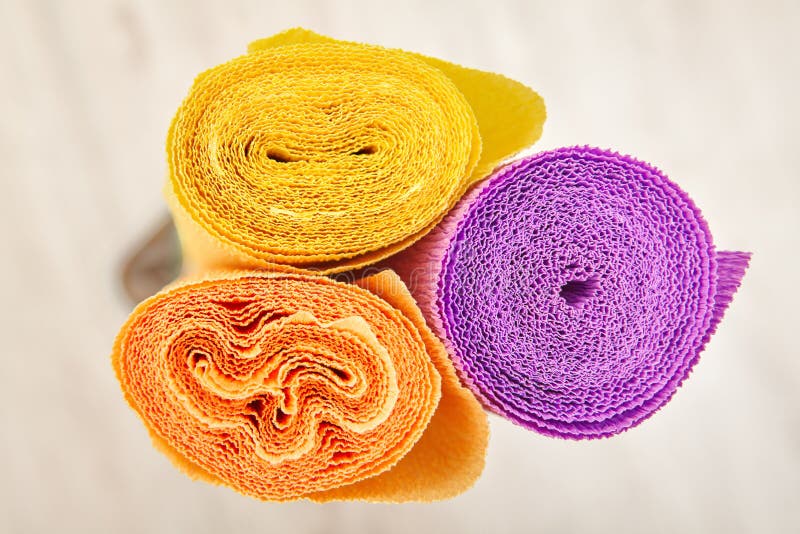 Three rolls of multi-colored crinkled paper for creativity and c royalty free stock photo Three rolls of multi-colored crinkled paper for creativity and c royalty free stock photo