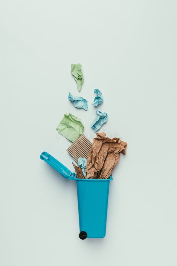 top view of trash bin with paper garbage isolated on grey, recycling concept stock image top view of trash bin with paper garbage isolated on grey, recycling concept stock image