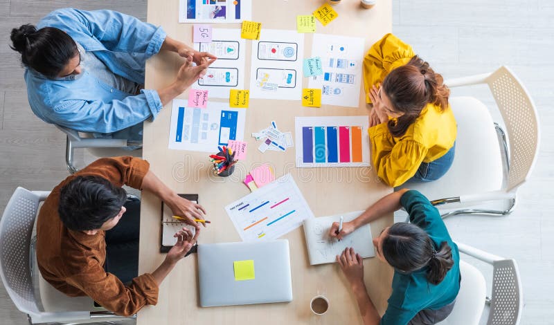 Top view ux developer and ui designer brainstorming about mobile app interface wireframe design on table with customer breif and royalty free stock photos