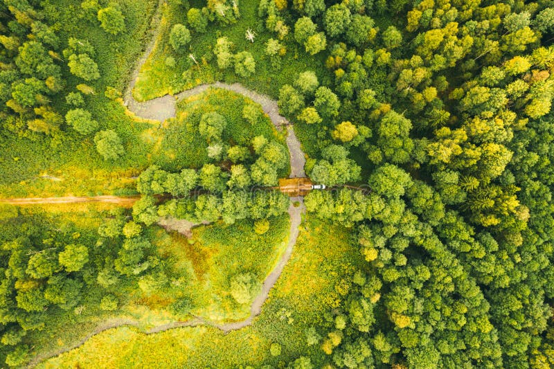 Top View Of The Valley Of A Meandering River Among Green Forests Stock