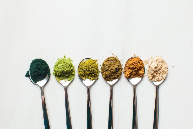 Top view of various dietary supplements in spoons