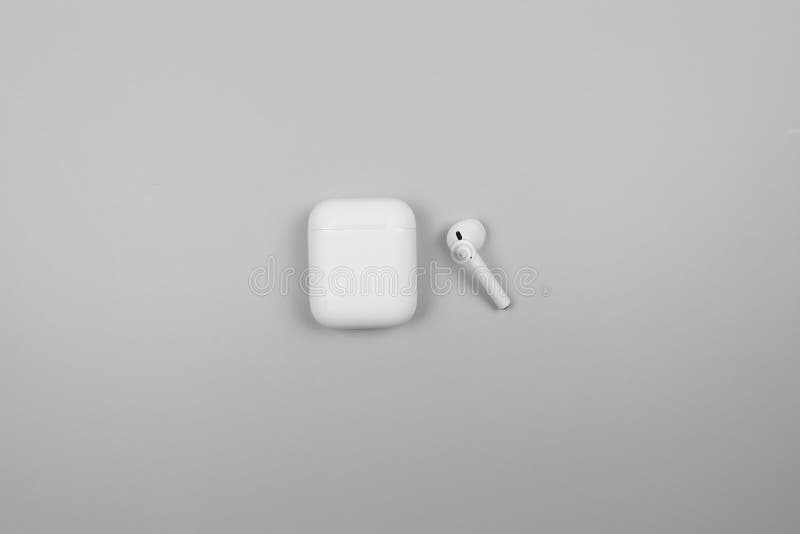 Top View of White Earphone Case on Light Grey Background. Stock Photo