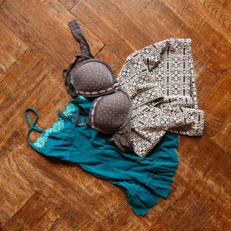 Bra on the wooden floor. Stock Photo