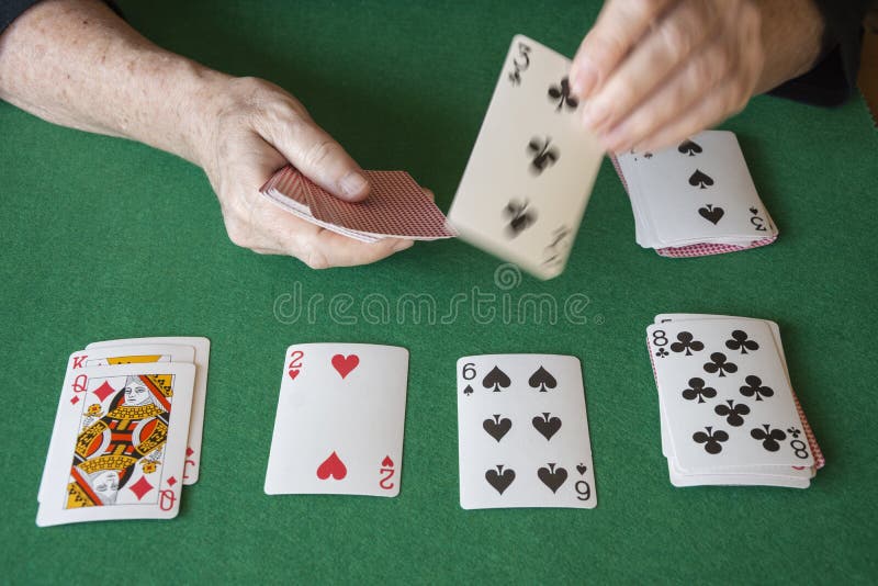 Top View Of Poker Cards On Green Mat With Woman S Hands Playing Solitaire Stock Photo Image Of Cards Fortune