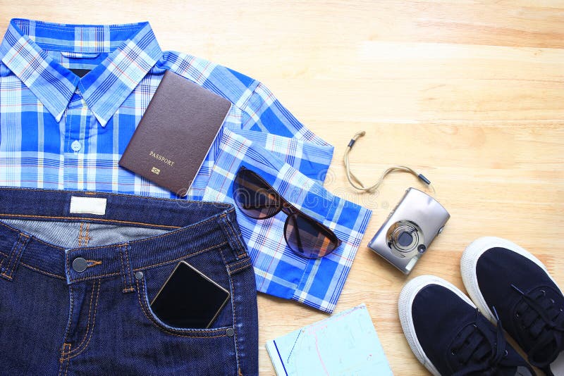 Top view of Women Fashion stylish clothes of travel accessories on wood table background, Planning for trip of Summer holiday royalty free stock photography Top view of Women Fashion stylish clothes of travel accessories on wood table background, Planning for trip of Summer holiday royalty free stock photography