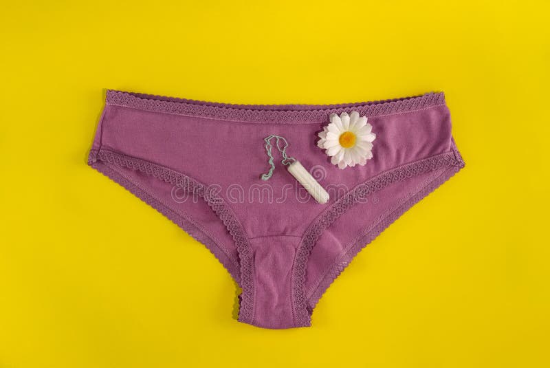 Woman in panties showing female tampon · Free Stock Photo