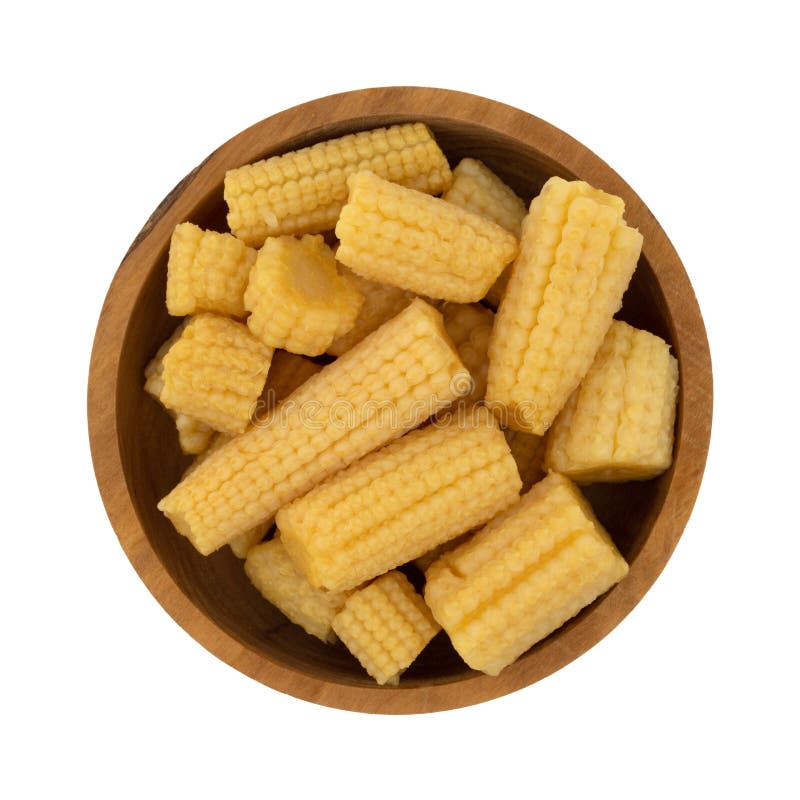 Top view of a wood bowl filled with canned organic baby corn isolated on a white background