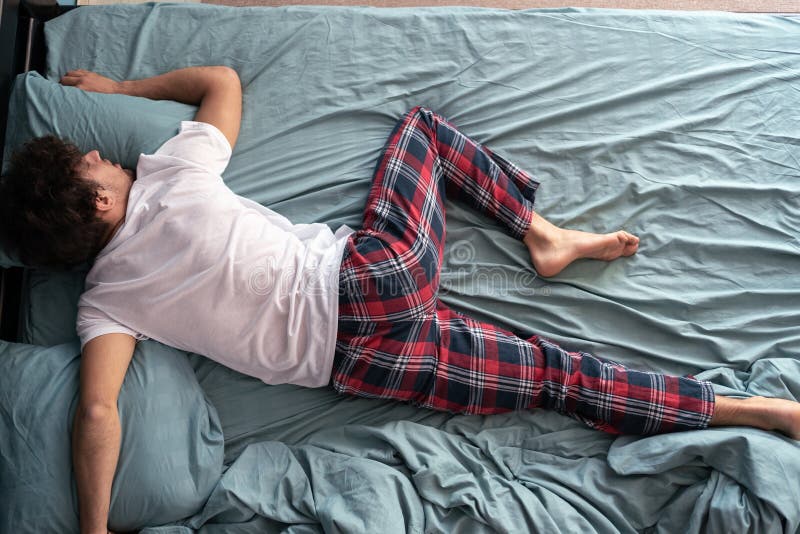 Top View of Young Arab Guy in Pajamas Resting at Home, Sleeping on His ...