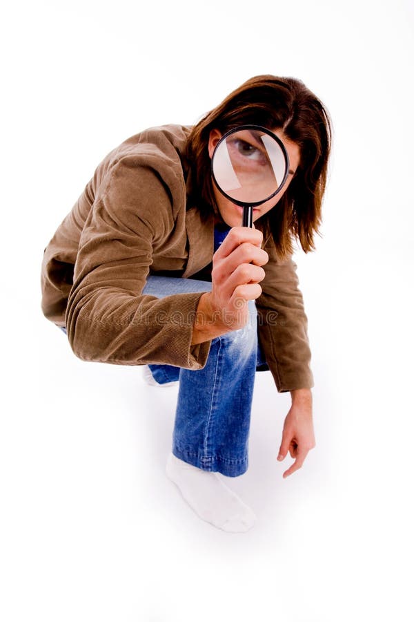 Top view of young man looking through lens