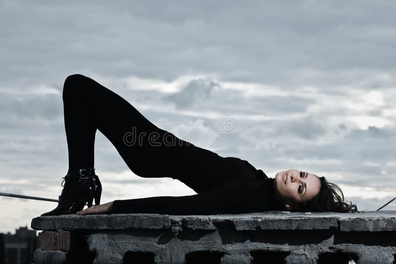 Portrait of young brunette girl over the sky with a lot of copy space. Portrait of young brunette girl over the sky with a lot of copy space