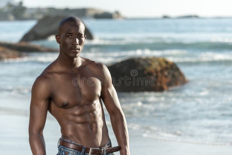 Topless african black man on beach