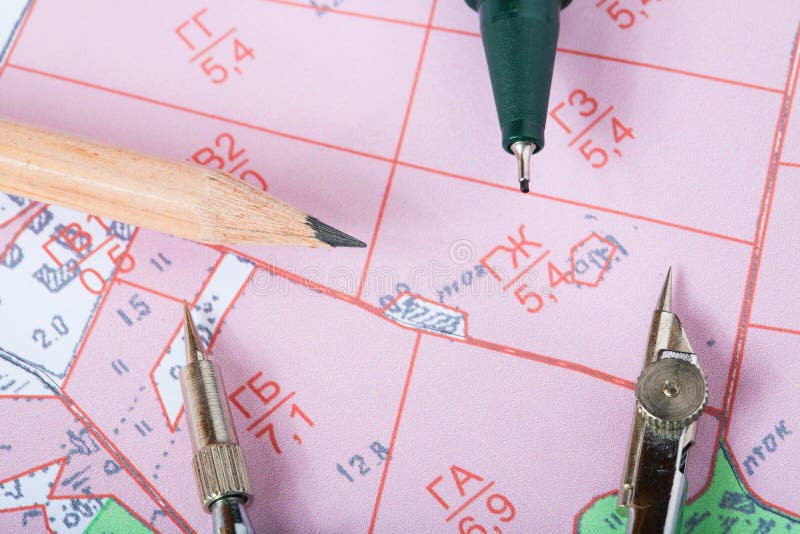 Topographic map of district with a instrument and pencils stock photos