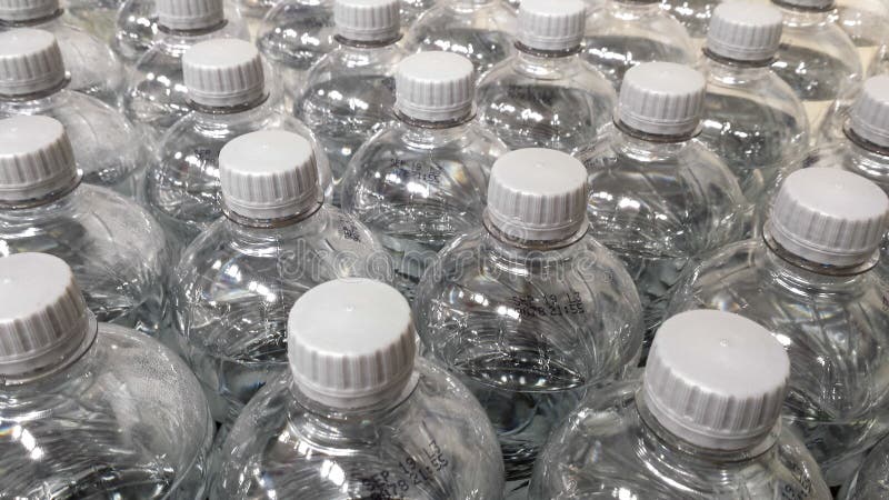 Download Tops Of Clear Plastic Bottles With White Caps Stock Photo - Image of environmental, background ...