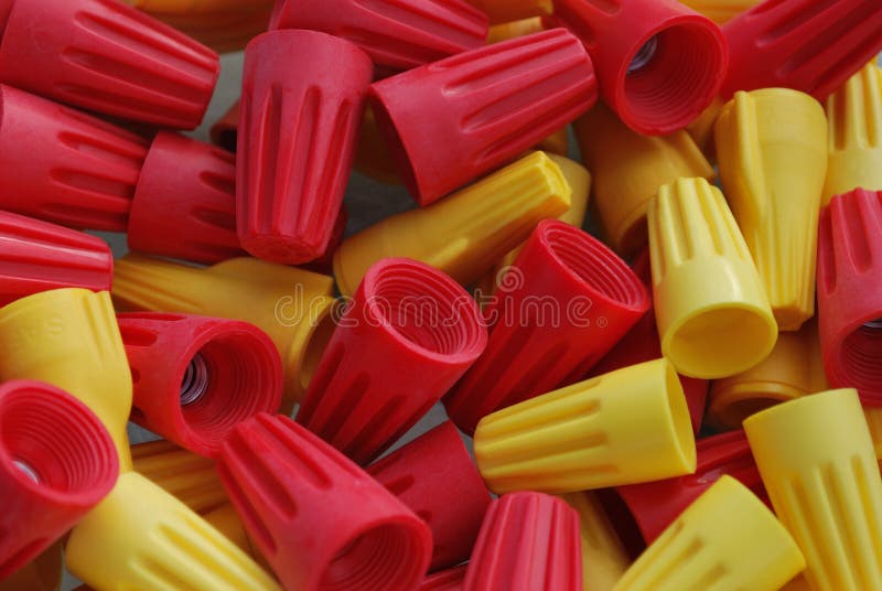 Close up of yellow and red twist on wire cap connectors. Close up of yellow and red twist on wire cap connectors.