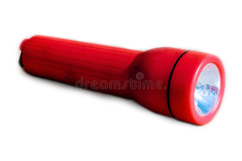 Torcia elettrica rossa su un fondo bianco fotografia stock libera da diritti Torcia elettrica rossa su un fondo bianco fotografia stock libera da diritti