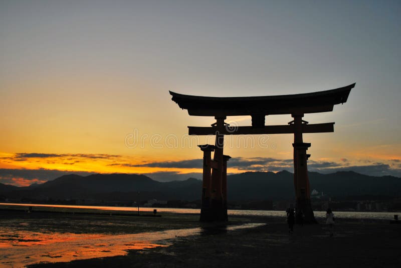 Torii gate of a temple during dusk