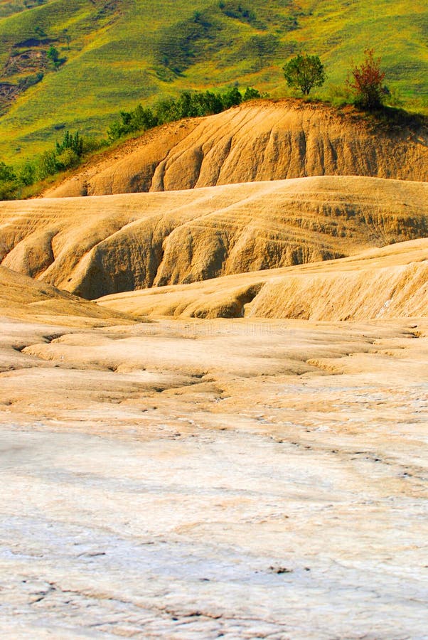 Dry land in foreground with lush, green field in background. Good image to demonstrate environmental impact issues. Dry land in foreground with lush, green field in background. Good image to demonstrate environmental impact issues.