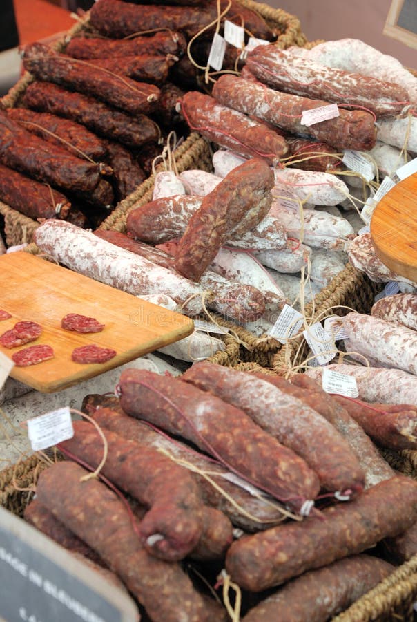 Dried speciality sausages on a market traders stall. Dried speciality sausages on a market traders stall.