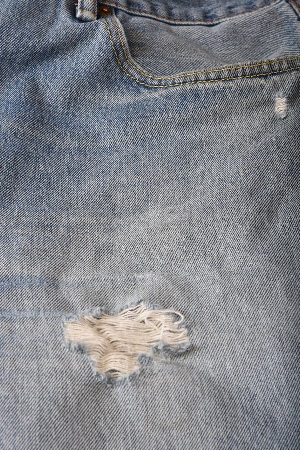 Frayed and torn old jeans stock image. Image of color - 4491903