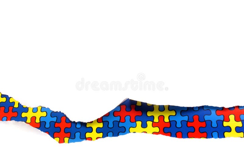 Torn white paper on multicolored puzzle background. Cocept for autism awareness day. Break barriers together for autism. stock images Torn white paper on multicolored puzzle background. Cocept for autism awareness day. Break barriers together for autism. stock images