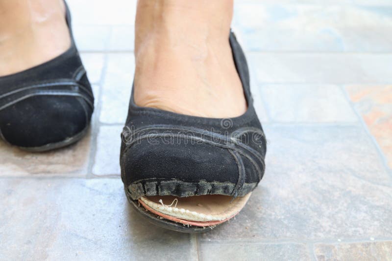 Torn Women& X27;s Shoes in the Street, Torn Shoe on Foot, Footwear ...
