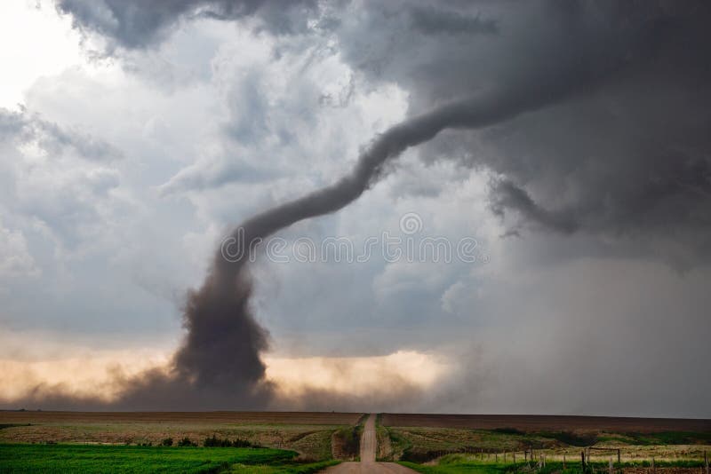 Tornado funnel with debris beneath a supercell thunderstorm during a severe weather outbreak. Tornado funnel with debris beneath a supercell thunderstorm during a severe weather outbreak.