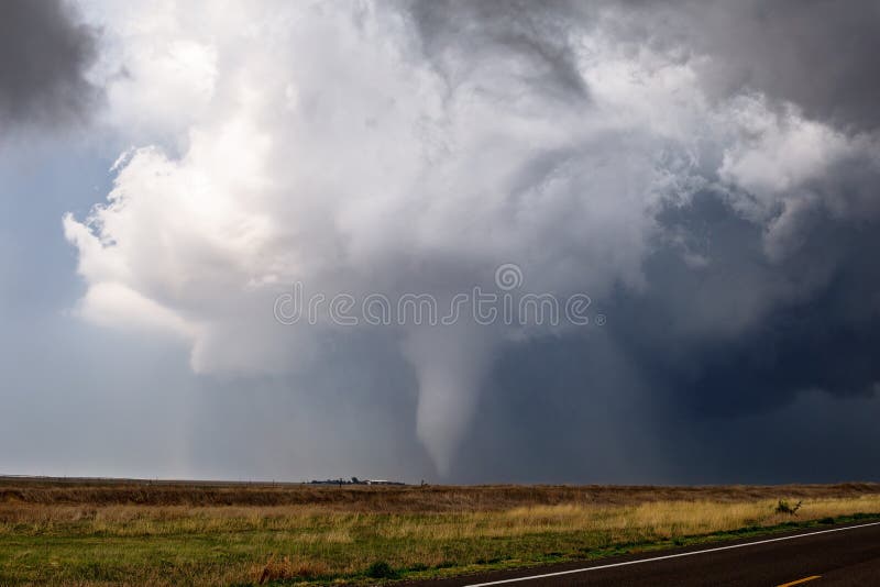 Tornado spins across a field near Ensign, Kansas.